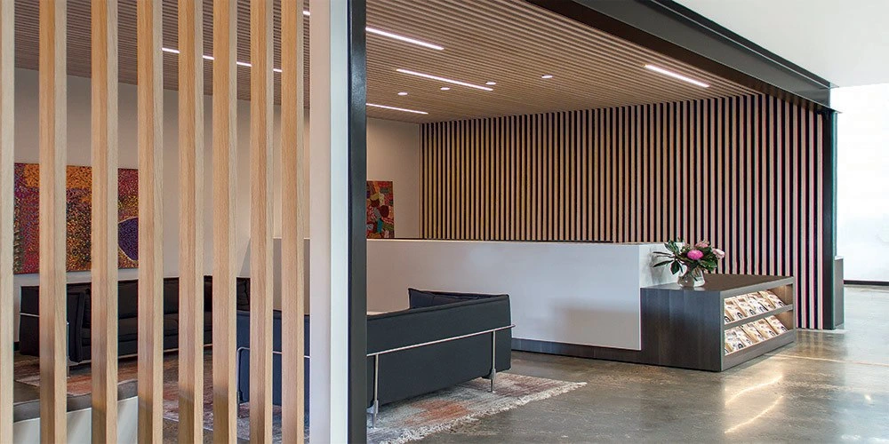 Ceiling Timber Panelling | A modern Sydney living room featuring a striking ceiling timber panelling and sleek design.