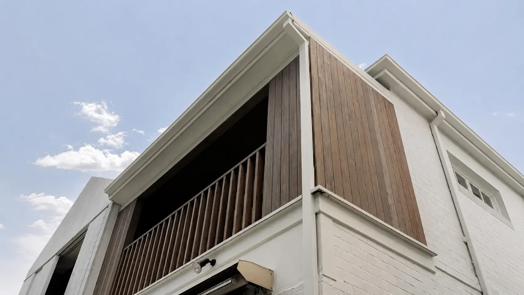 Modern Wall Cladding Sydney home featuring timber, metal and render exterior design
