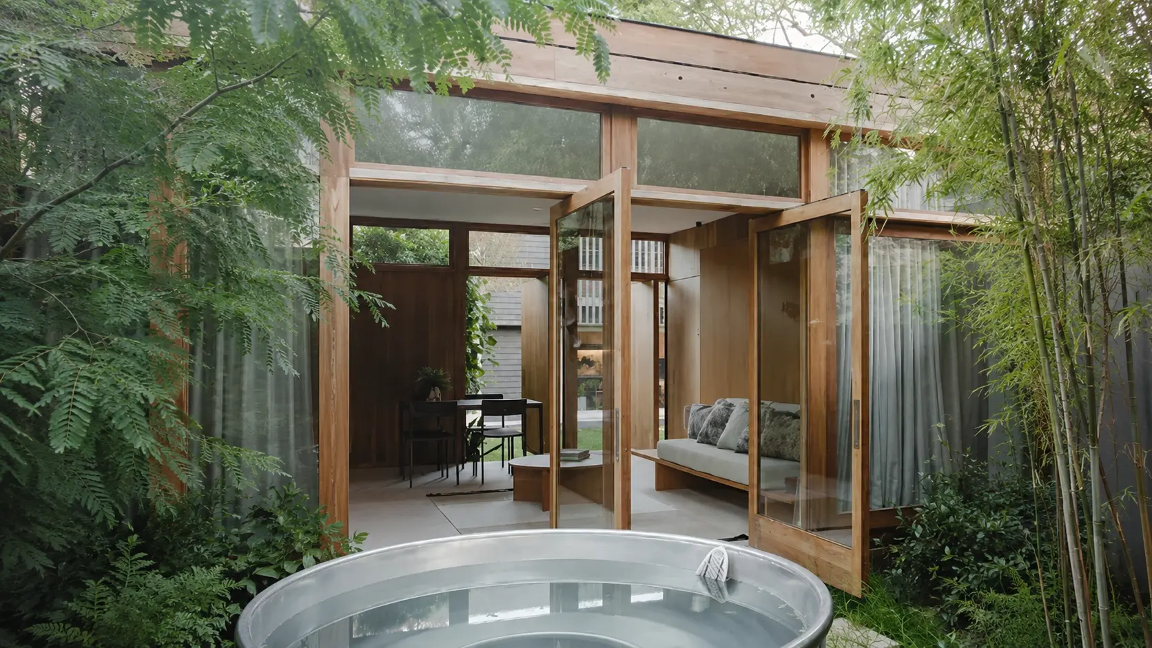 Modern Sydney living room featuring Ceiling Timber Panelling in Sydney, warm wooden ceiling panels, natural light, and a stylish contemporary interior